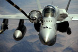STK104589M
An F/A-18C Hornet receives fuel from the drogue of a KC-10 Extender.