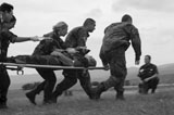 STK104723M
Multinational medical personnel race to a Macedonian MI-17 with a wounded patient.