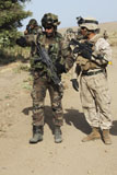 STK104732M
A Spanish Marine points out an improvised explosive device indicator to a U.S. Marine.
