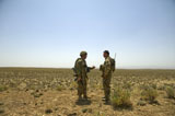 STK104764M
Soldiers discuss, drop zone establishment procedures near an Afghan border.