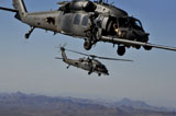 STK104921M
Two HH-60 Pave Hawk helicopters prepare for aerial refueling.