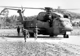 STK105030M
Soldiers run to a HH-53C helicopter during an asualt on Koh Tang Island.