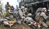 STK105040M
Pararescuemen prepare to transport wounded soldiers.