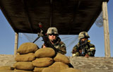 STK105050M
Soldiers provide security from a lookout tower.