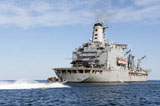 STK105216M
Marines in an inflatable boat head towards USS New York.