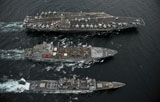 STK105226M
U.S. Navy ships conduct a replenishment at sea in the Pacific Ocean.