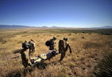 STK105368M
U.S. Air Force Pararescuemen carry litter patients.