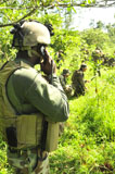 STK105532M
A Riverine soldier radios in mock simulations.