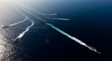 STK105630M
Ships from the John C. Stennis Carrier Strike Group transit the Pacific Ocean.