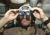 STK105658M
Sailor adjusts his AN/AVS-9 night vision goggles.