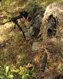 STK105691M
Sharpshooters sneak through the forest in their ghillie suits.