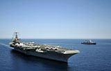 STK105706M
USS Harry S. Truman cruises alongside the German Navy frigate FGS Hessen.