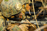 STK105934M
U.S. Marine uses a spotting scope to help fellow Marine identify a target.