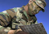 STK105953M
U.S. Air Force Lieutenant reviews the equipment accountability log.