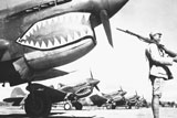 STK106032M
A Chinese soldier guards a line of American P-40 fighter planes during WWII.