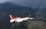 STK106042M
Minute Men paint scheme on an F-16 Fighting Falcon over Rocky Mountains.