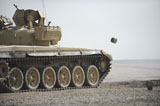 STK106056M
Empty casings eject from an Iraqi T-72 tank on the firing range.
