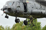 STK106080M
Polish special forces member fast-ropes from a Lithuanian Mi-8 helicopter.