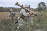STK106140M
Marines conduct a simulated attack using assault weapons.