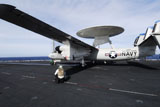 STK106151M
Sailors guide an E-2C Hawkeye to a steam driven catapult.