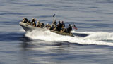 STK106192M
A visit, board, search and seizure team in a rigid-hull inflatable boat.
