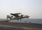 STK106223M
An E-2C Hawkeye takes off from the flight deck of USS Enterprise.