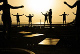 STK106430M
Sailors exercise in the hangar bay aboard USS Dwight D. Eisenhower.