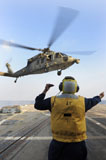STK106684M
Boatswain's Mate directs an MH-60S Sea Hawk aboard USS Farragut.