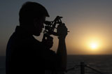 STK106716M
Quartermaster uses a statometer aboard USS Mobile Bay.