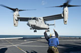 STK106759M
Aviation Boatswain's Mate signals an MV-22 Osprey for liftoff.