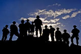 STK106880M
Soldiers watch troop movements at Fort Irwin, California.