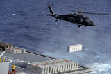 STK106907M
An MH-60S Sea Hawk helicopter picks up ammunition from USNS William McLean.