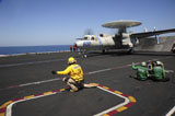 STK106963M
An E-2C Hawkeye launches from the flight deck of USS Dwight D. Eisenhower.