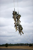 STK107025M
U.S. Soldiers are lifted off the ground by a CH-47 Chinook helicopter.