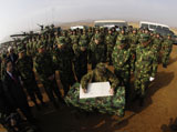 STK107043M
General Peter Pace signs a message for members of the People's Liberation Army.