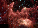 STK200041S
Towering pillars of cool gas and dust are illuminated at their tips with light from warm, embryonic stars.