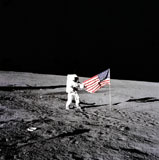 STK200060S
Apollo astronaut stands beside the United States flag after it was unfurled on the lunar surface