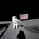 STK200063S
Apollo astronaut stands beside the United States flag after it was unfurled on the lunar surface