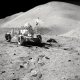 STK200079S
Apollo 15 astronaut works at the Lunar Roving Vehicle on the moon's surface.