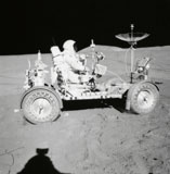 STK200080S
Astronaut is seated in the Lunar Roving Vehicle during an Apollo moonwalk.