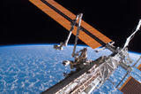 STK201556S
The Canadarm2 and solar array panel wings on the International Space Station.