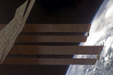 STK202548S
International Space Station's solar array panels and Earth's horizon.