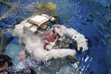 STK203073S
An astronaut is submerged in the water while wearing a Extravehicular Mobility Unit spacesuit.