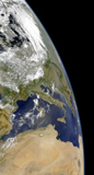 STK203504S
View of the western Mediterranean with visible smoke in the Balkans and dust from the Sahara desert.