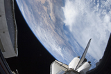 STK203528S
Part of space shuttle Discovery backdropped against the Pacific Coast of California.