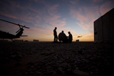 TMO100207M
A UH-60 Black Hawk crew carry out a mission brief at sunset.