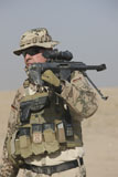 TMO100418M
A German soldier carries a Barrett M82A1 rifle.