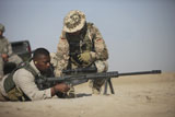 TMO100423M
Fijian contractor clearing his Barrett M82A1 rifle.