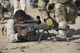 TMO100424M
Fijian contractor firing a Barrett M82A1 rifle.
