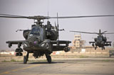 TMO100727M
Two AH-64 Apache helicopters return from a mission over Iraq.
